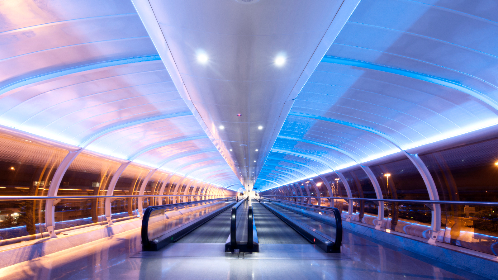 A tunnel linking to Manchester airport terminals taken at night