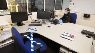 An employee at the Vauxhall car factory in the United Kingdom working in his office during preparedness tests and redesign ahead of re-opening following the COVID-19 outbreak.