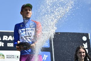 Filippo Zana celebrates his overall victory in the Adriatica Ionica Race 2022