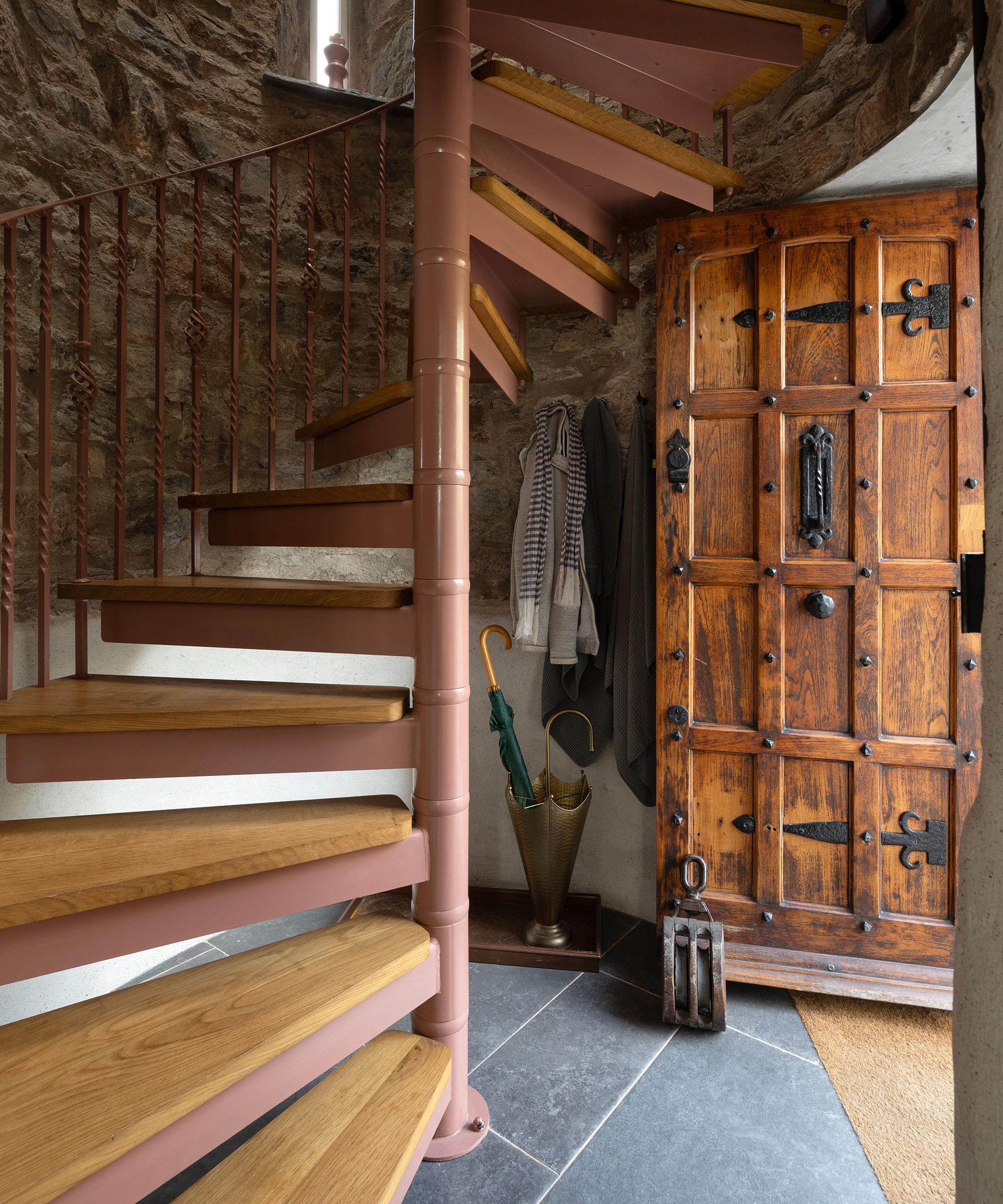 wooden door and staircase in a renovated castle
