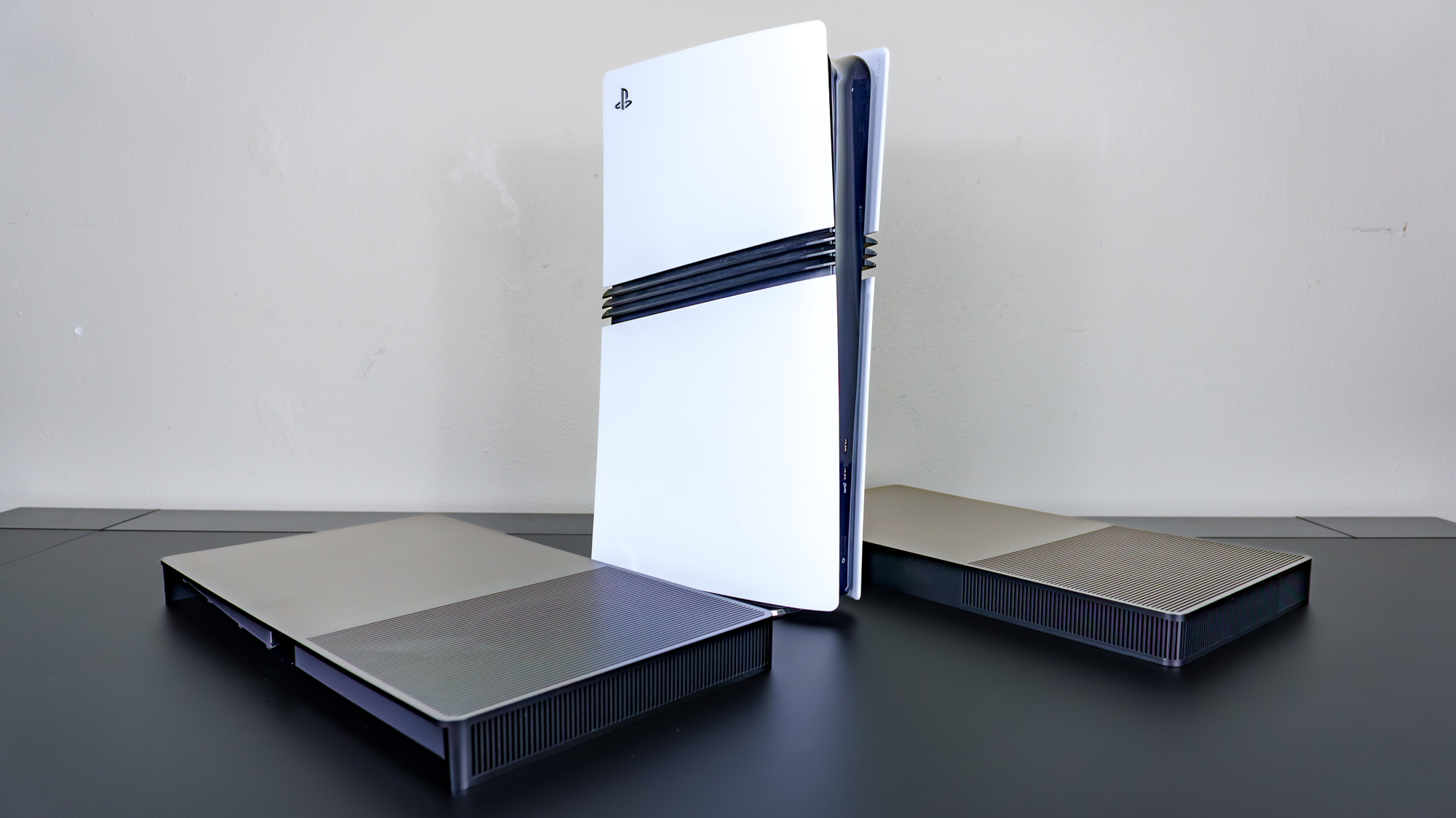 A PS5 Pro next to a set of BoxPlates console covers on a desk