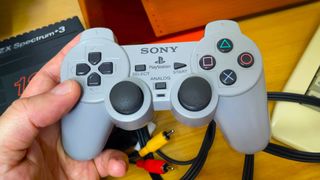 Front view of PlayStation PUGA PS1 plug-and-play controller console.
