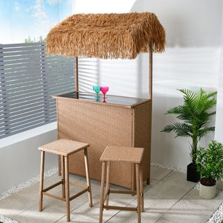 room with white wall and tiki bar and chair