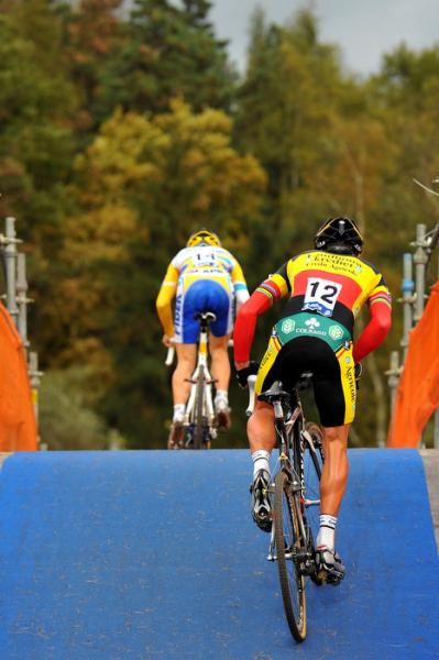 Belgian champion Sven Nys pursues Kevin Pauwels on the fly-over.