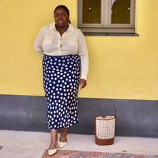 @abimarvel wearing polka dot skirt and top