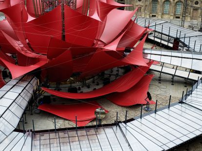 A giant red flower made out of tarpaulin-style fabric by artist Philippe Parreno