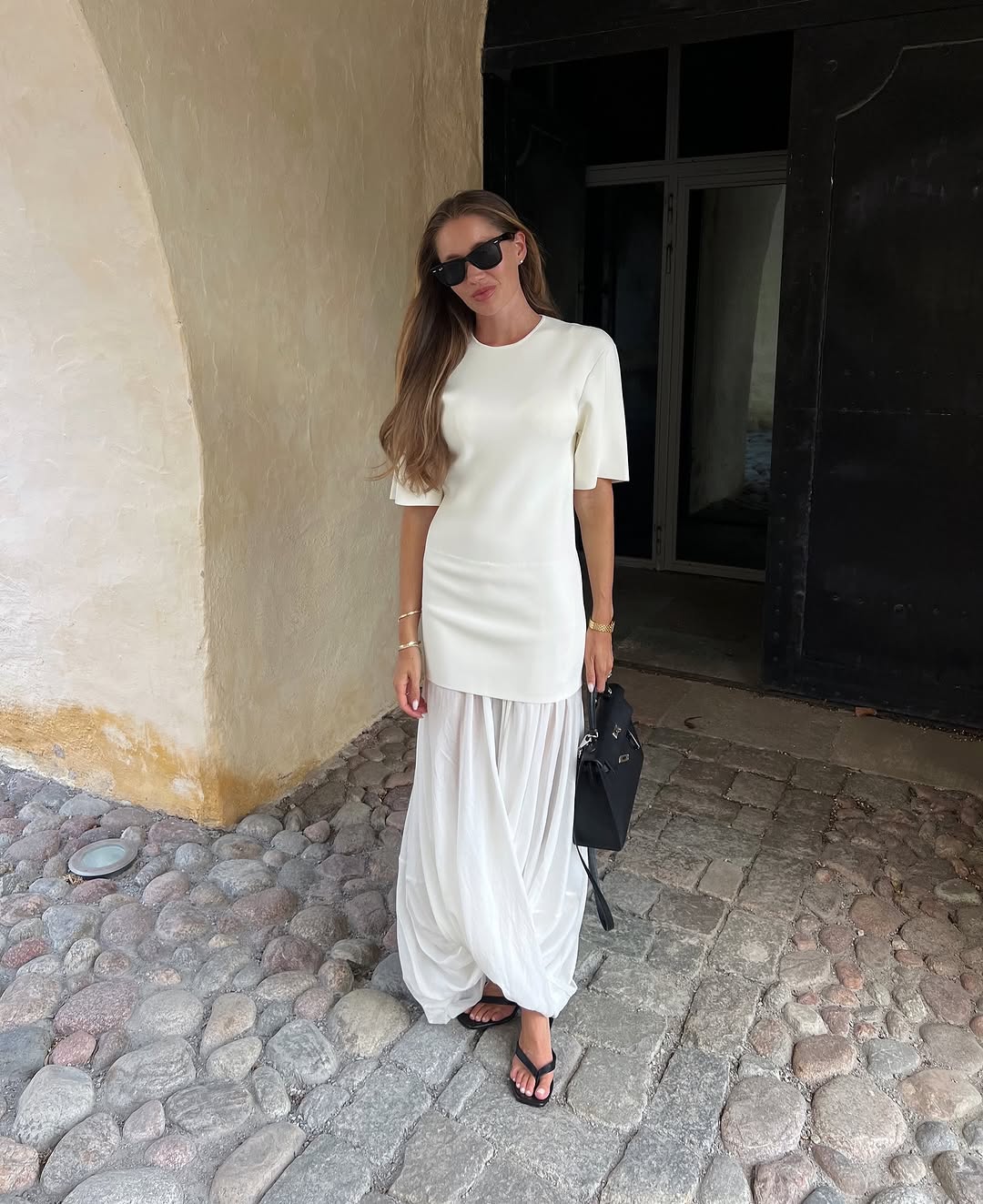 woman wearing exaggerated drop waist summer 2025