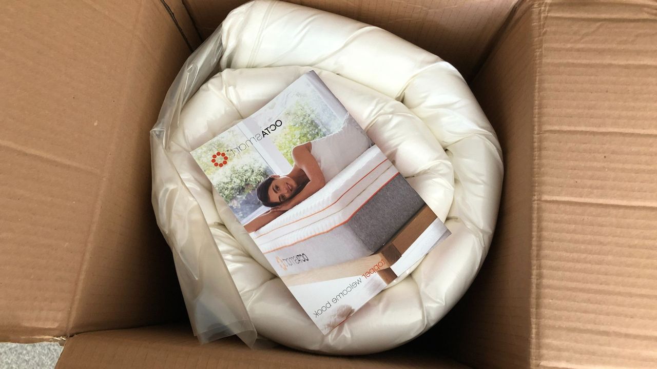 Octasmart's welcome booklet in the topper's box