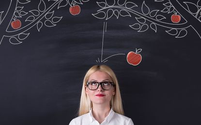 Apple falling on a person's head.