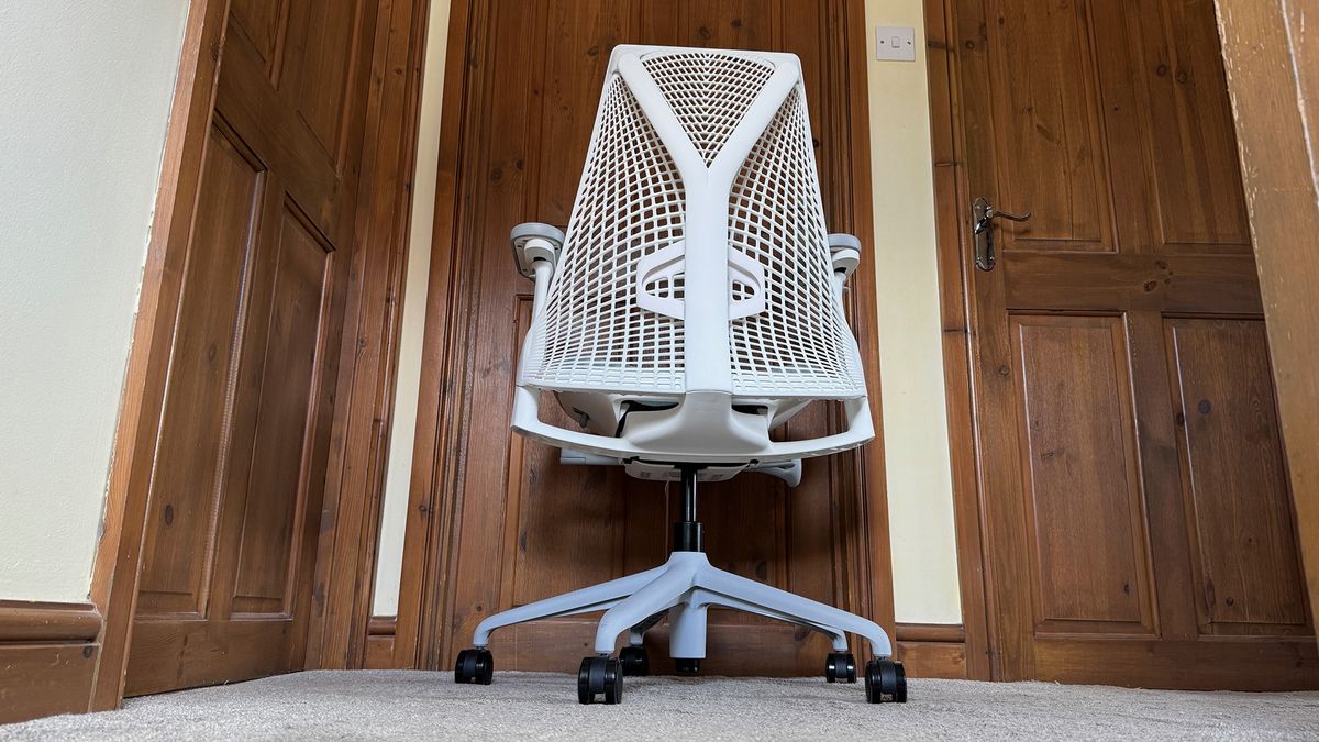 Three different shots of the Sayl chair in a hallway.