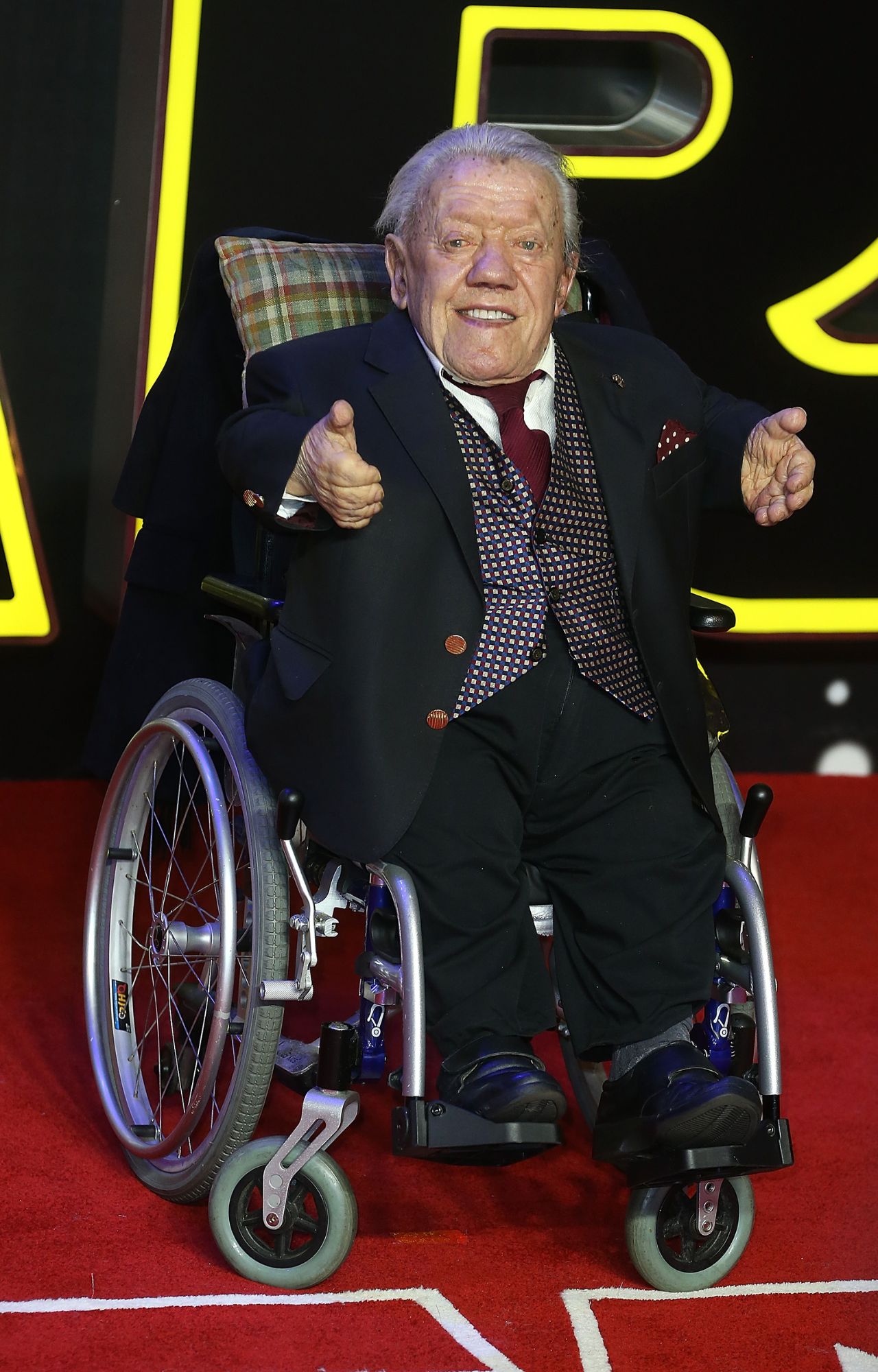 Kenny Baker attends the european premiere of Star Wars: The Force Awakens 2015. He passed in 2016.
