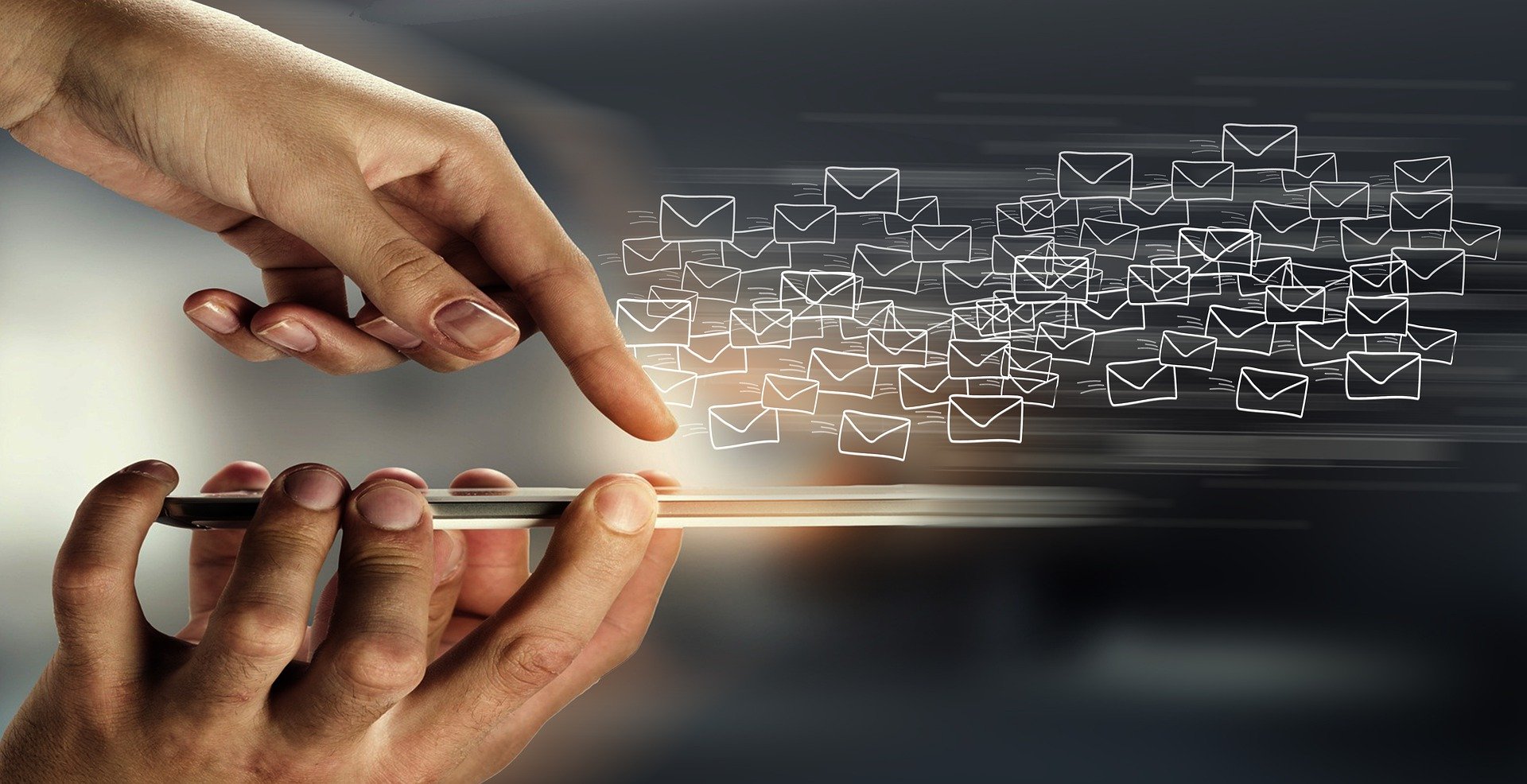 An image of emails erupting like a flock of birds from a mobile device.