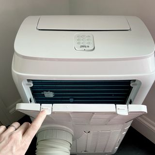 The Russell Hobbs RHPAC11001 Portable Air Conditioner air filter being opened