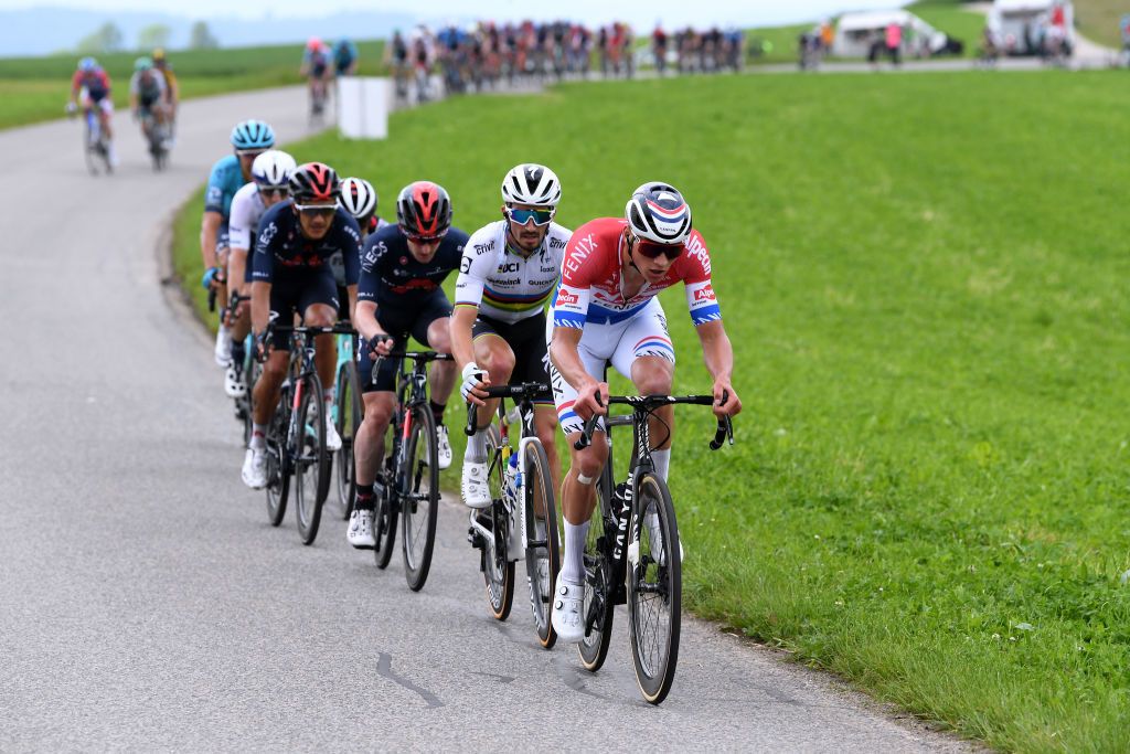 PFAFFNAU SWITZERLAND JUNE 08 Richard Carapaz of Ecuador Eddie Dunbar of Ireland and Team INEOS Grenadiers Julian Alaphilippe of France and Team Deceuninck QuickStep Mathieu Van Der Poel of Netherlands and Team AlpecinFenix in the Breakaway during the 84th Tour de Suisse 2021 Stage 3 a 185km stage from Lachen to Pfaffnau 509m UCIworldtour tds tourdesuisse on June 08 2021 in Pfaffnau Switzerland Photo by Tim de WaeleGetty Images
