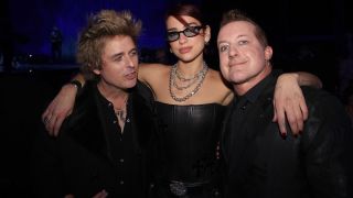 Dua Lipa with Billie Joe Armstrong and Tre Cool at the BRIT Awards in 2024