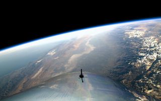 Virgin Galactic's VSS Unity spaceliner over Earth