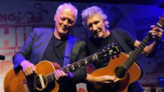 LONDON, ENGLAND - JULY 10: (NO UK MONTHLY MAGAZINES OR EQUIVALENT ONLINE SITES - NO UK EDITIONS OF HELLO OR OK MAGAZINES - EMBARGOED FOR PUBLICATION IN UK TABLOID NEWSPAPERS UNTIL 48 HOURS AFTER CREATE DATE AND TIME. MANDATORY CREDIT PHOTO BY DAVE M. BENETT/GETTY IMAGES REQUIRED) David Gilmour (L) and Roger Waters perform at a benefit evening for The Hoping Foundation on July 10, 2010 in London, England.