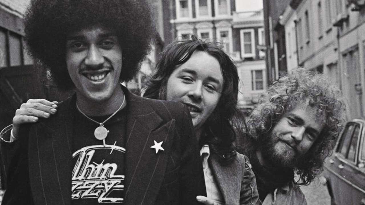 Thin Lizzy posing in a street, 1973