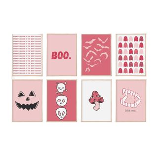 A collection of pink Halloween themed wall art
