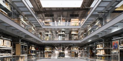 A back-lit, retro-inspired warehouse houses the centuries-spanning collection of a museum.