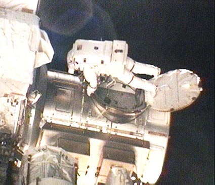 Shuttle Astronauts Take Mission&#039;s First Spacewalk