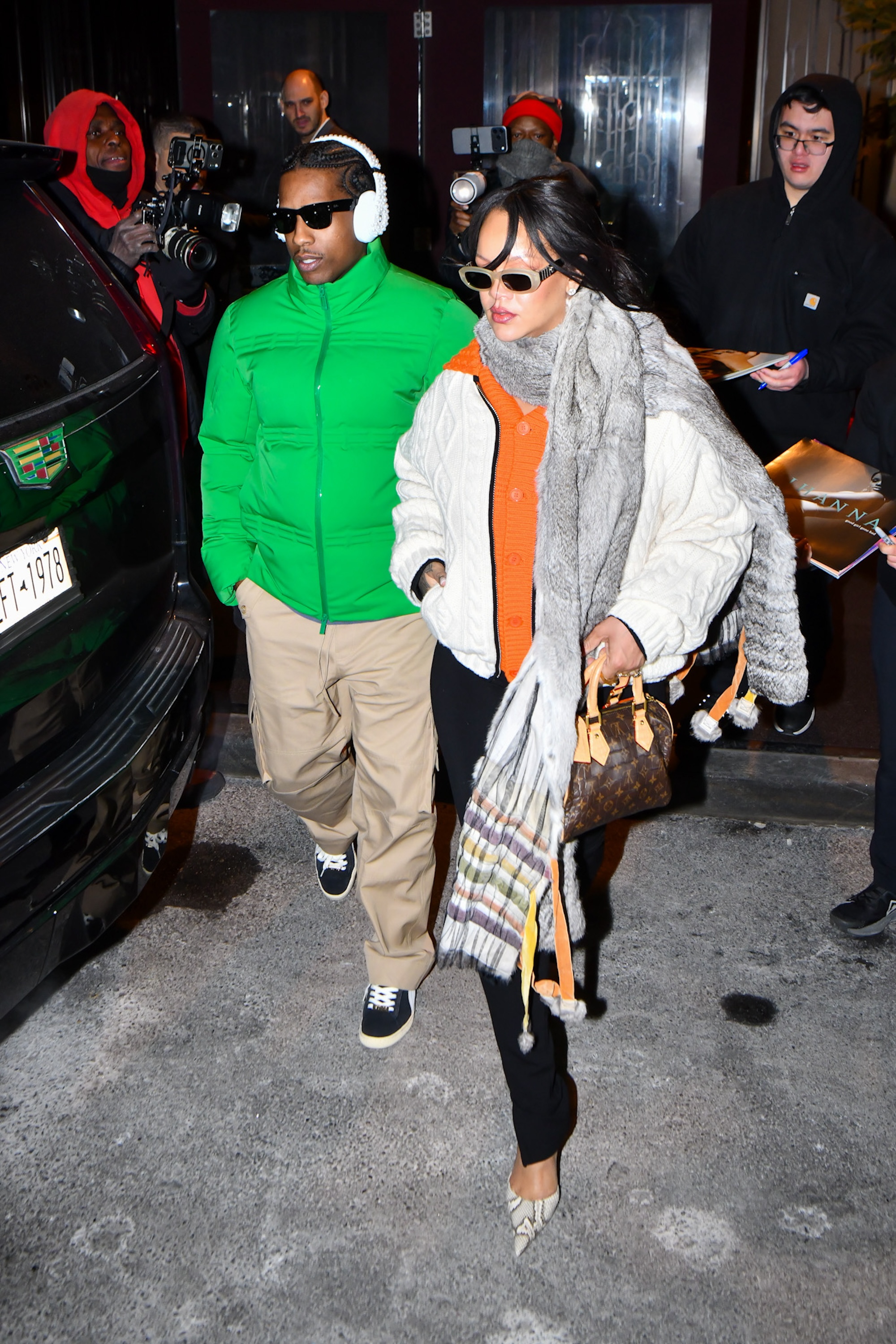 Rihanna was spotted with A$AP Rocky wearing an oversize cardigan with leggings and a Louis Vuitton bag