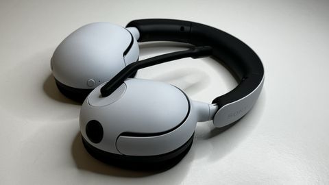 Sony InZone H5 gaming headset on a desk with packaging.
