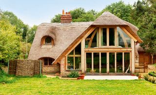 Oak frame glazed extension to 17th century listed thatched cottage