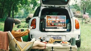 The LG StanbyMe Go in the back of an SUV.