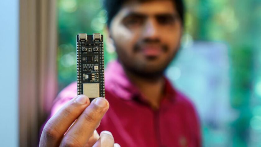 Ph.D. student Nayan Bhatia holding a Pulse-Fi module