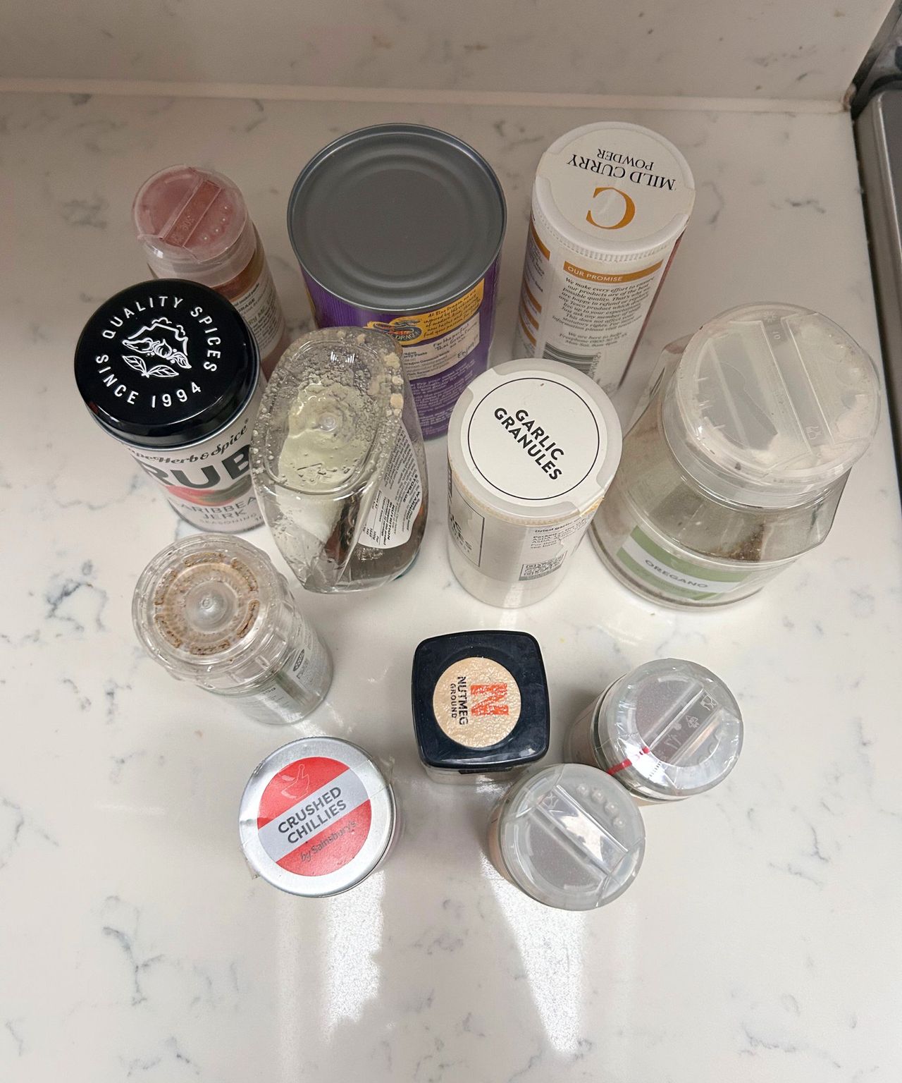 Odd spices on a white kitchen countertop