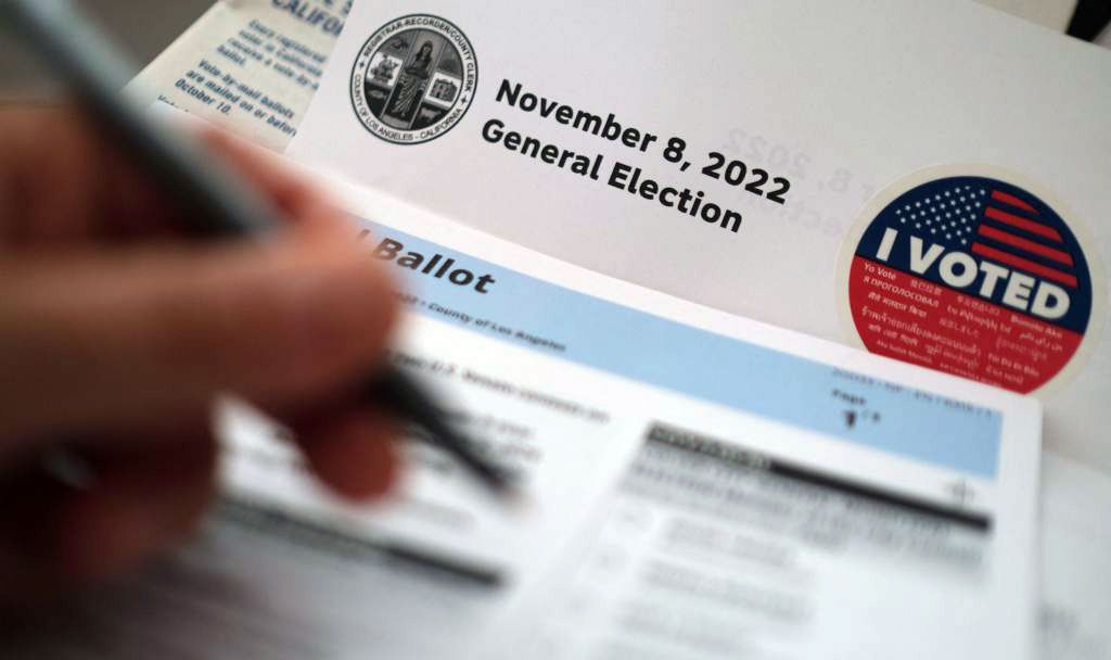 voter filling out election ballot