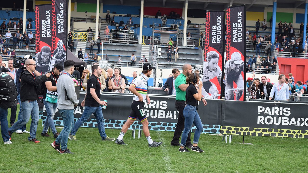 Peter Sagan walks with his entourage following the podium presentation