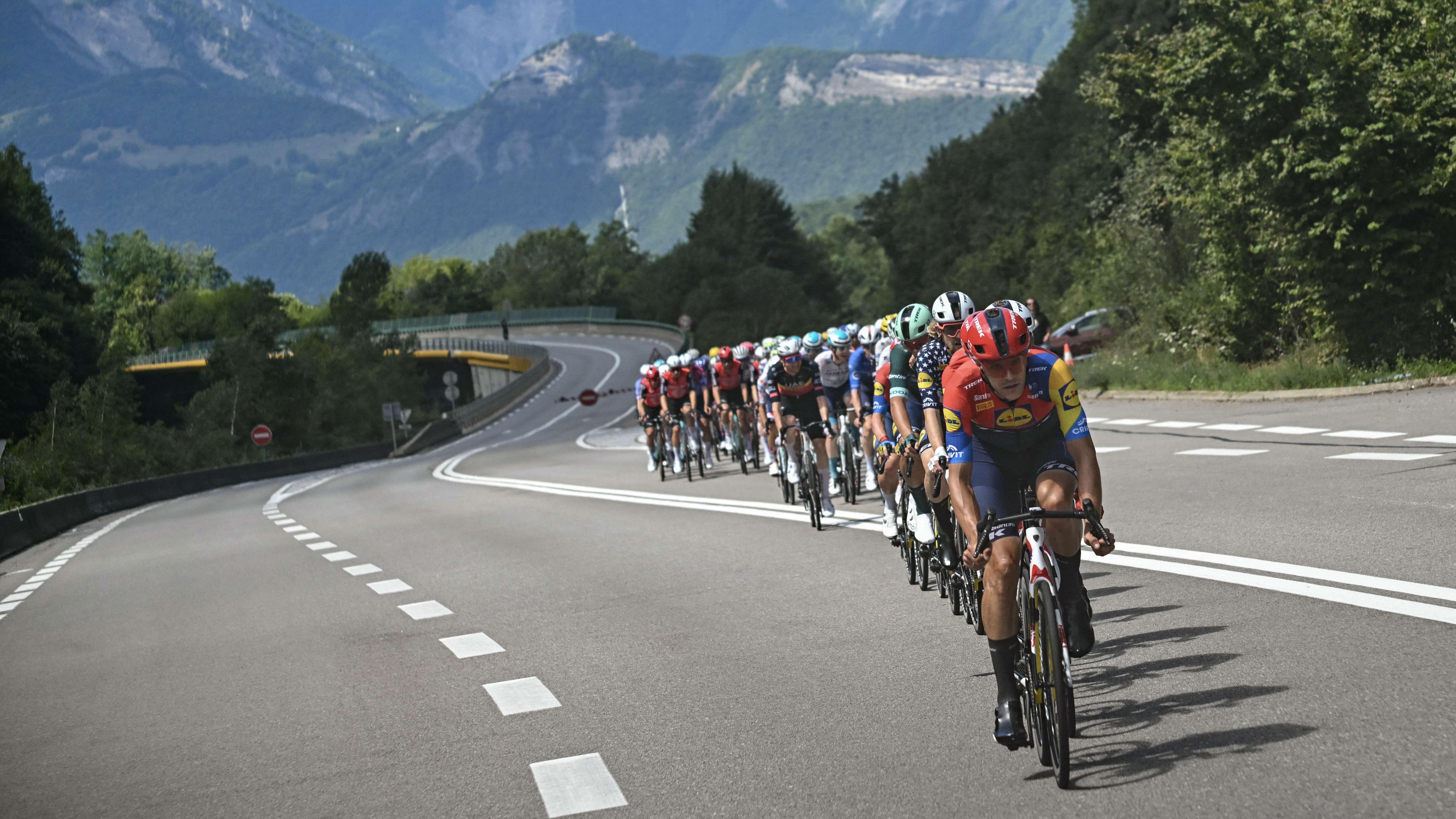 Lidl - Trek team&#039;s Belgian rider Jasper Stuyven leads the pack of riders (peloton) during the 18th stage of the 112th edition of the Tour de France cycling race, 171.5 km between Vif and Courchevel Col de la Loz