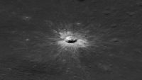 A black and white image of a clear, round crater.