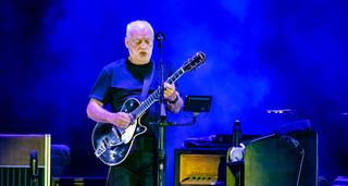 David Gilmour wears a black T-shirt and plays a Gretsch Duo Jet onstage in Italy.