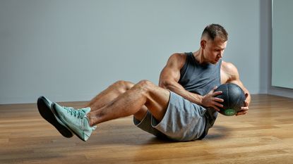 Man performing Russian twists