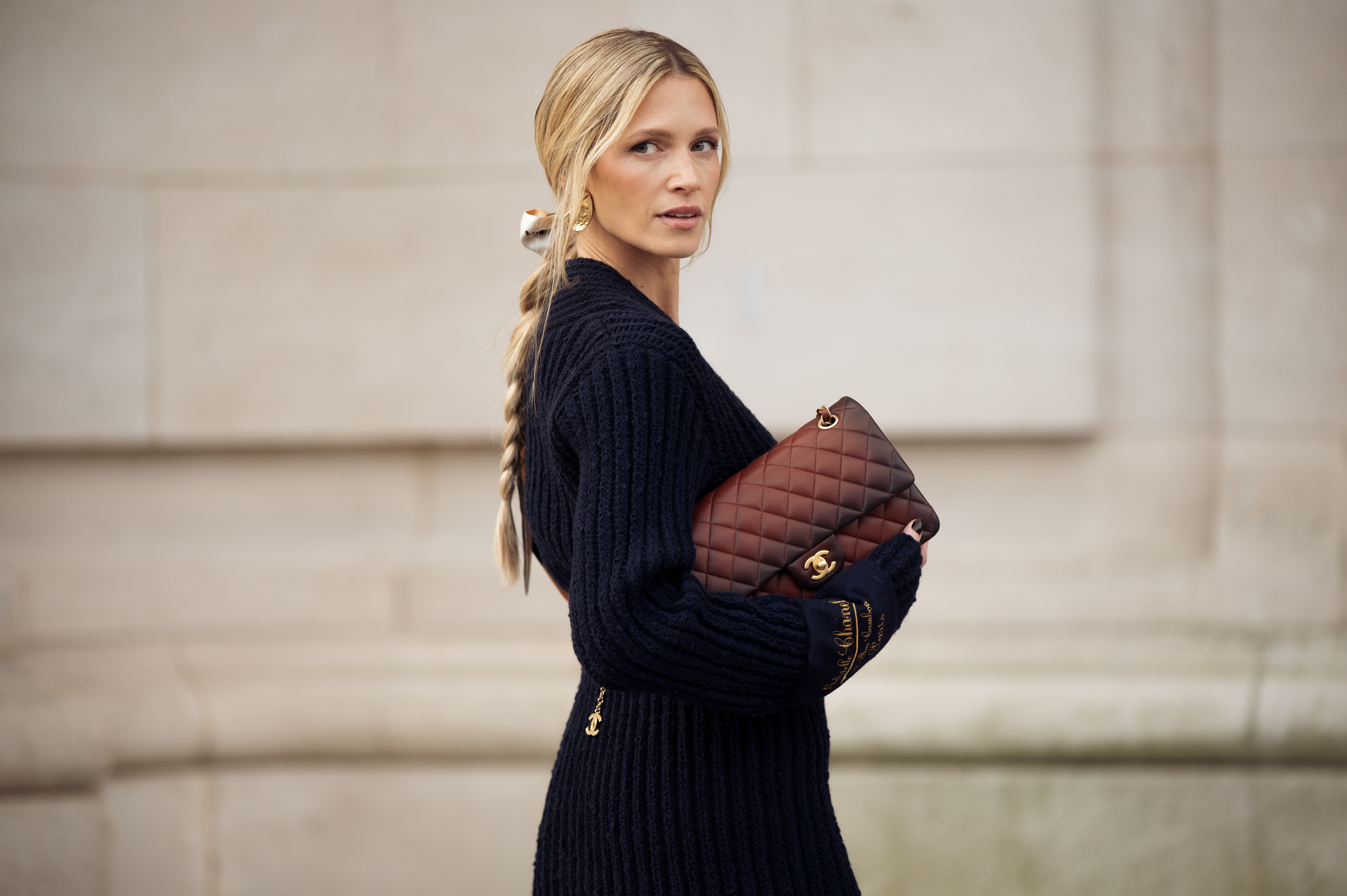 a woman carrying a chanel bag