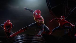 The three live-action Spider-Men pose on a rooftop in Spider-Man: No Way Home
