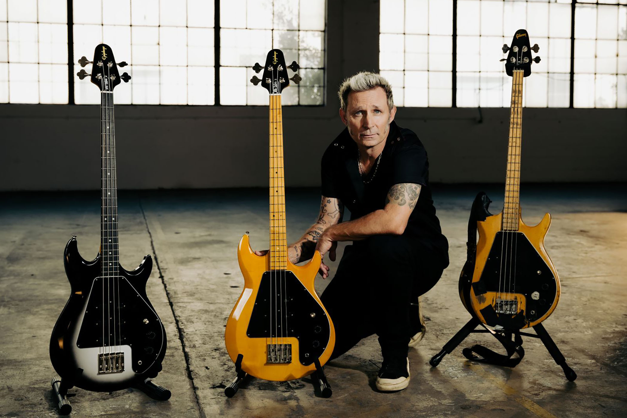 The Epiphone Mike Dirnt G-3 Grabber is an affordable replica of his original Gibson and features a trio of Gibson USA pickups, custom wiring, and is available in Natural and Silverburst finishes.