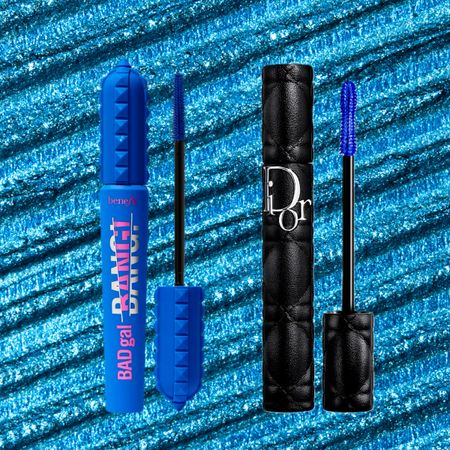 an edit of two tubes of blue mascara sitting on a bright blue background