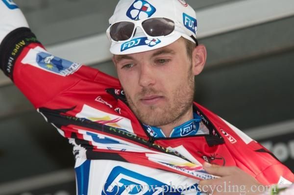 C&eacute;dric Pineau (FDJ) puts on the red jersey for most combative rider.