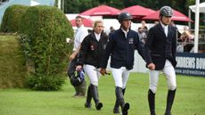 Three riders walking the course at Hickstead