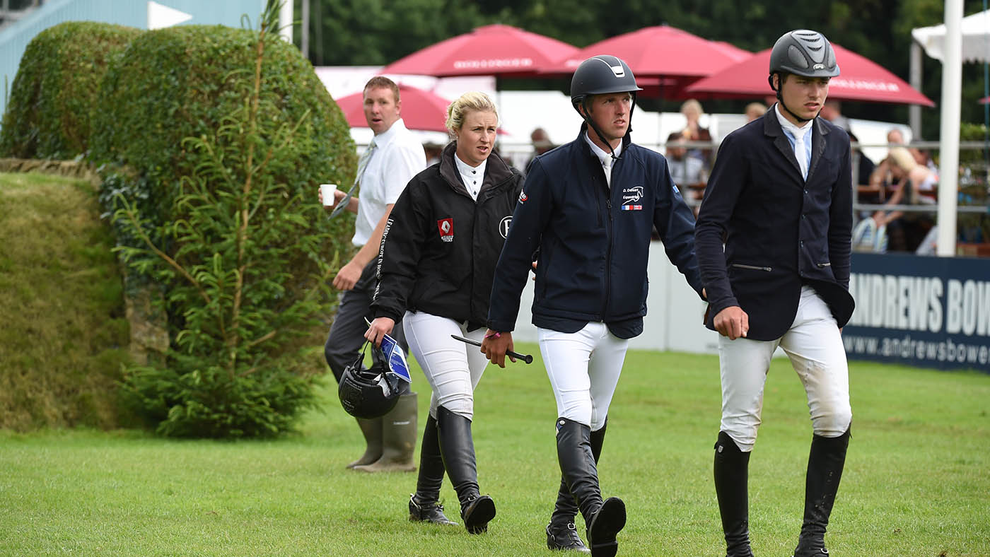 Three riders walking the course at Hickstead