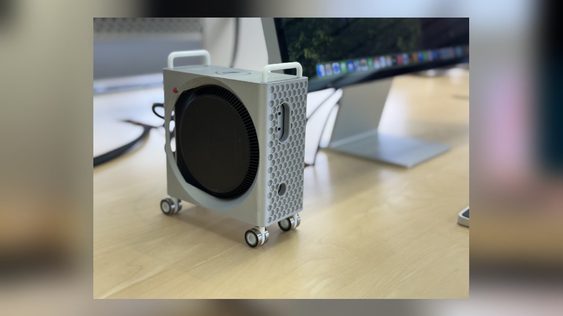 A M4 Mac Mini has been mounted inside of a 3D printed case, making the tiny hardware look like a shrunk down Mac Pro tower.