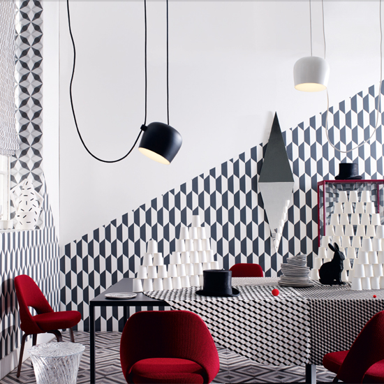 room with geometric pattern printed wall in black and white