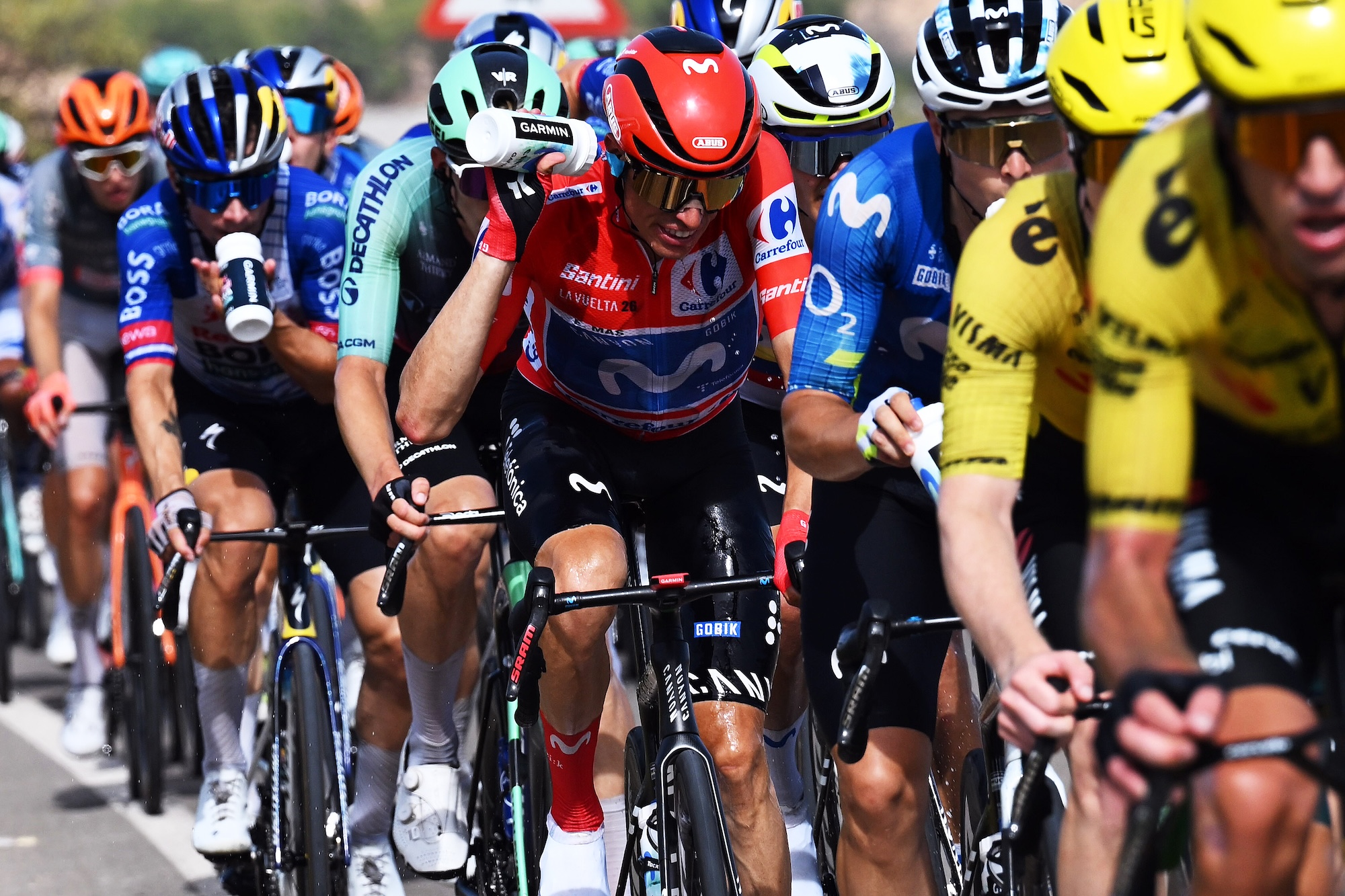 Riders at Vuelta a Espa&ntilde;a, including race leader Enric Mas of Movistar, try to cool down with water