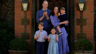 Prince William, Duke of Cambridge, Catherine Duchess of Cambridge, Prince George of Cambridge, Princess Charlotte of Cambridge and Prince Louis of Cambridge standing outside their home.
