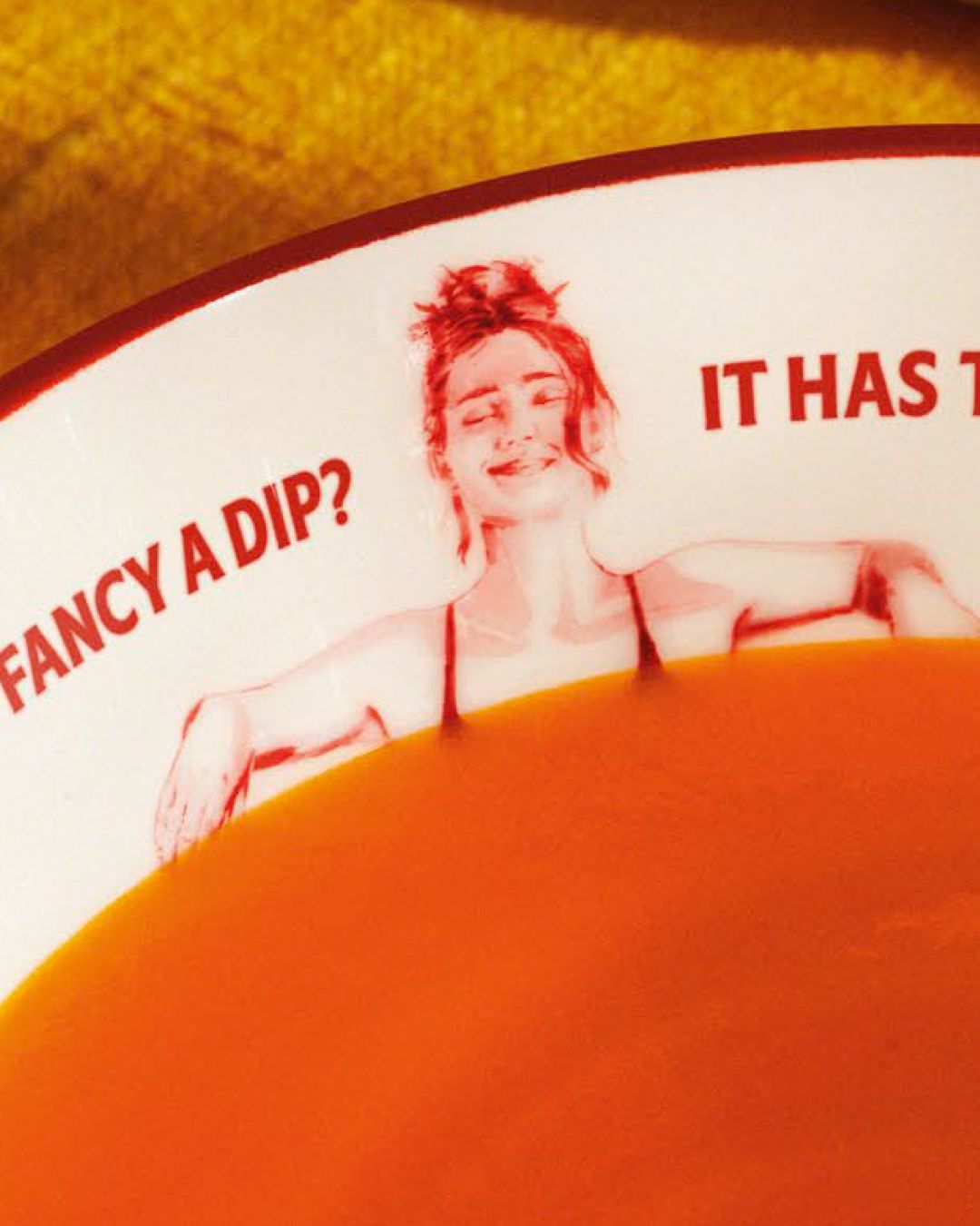 Heinz tomato soup campaign with illustrated people who look like they're having a bath in a bowl of soup