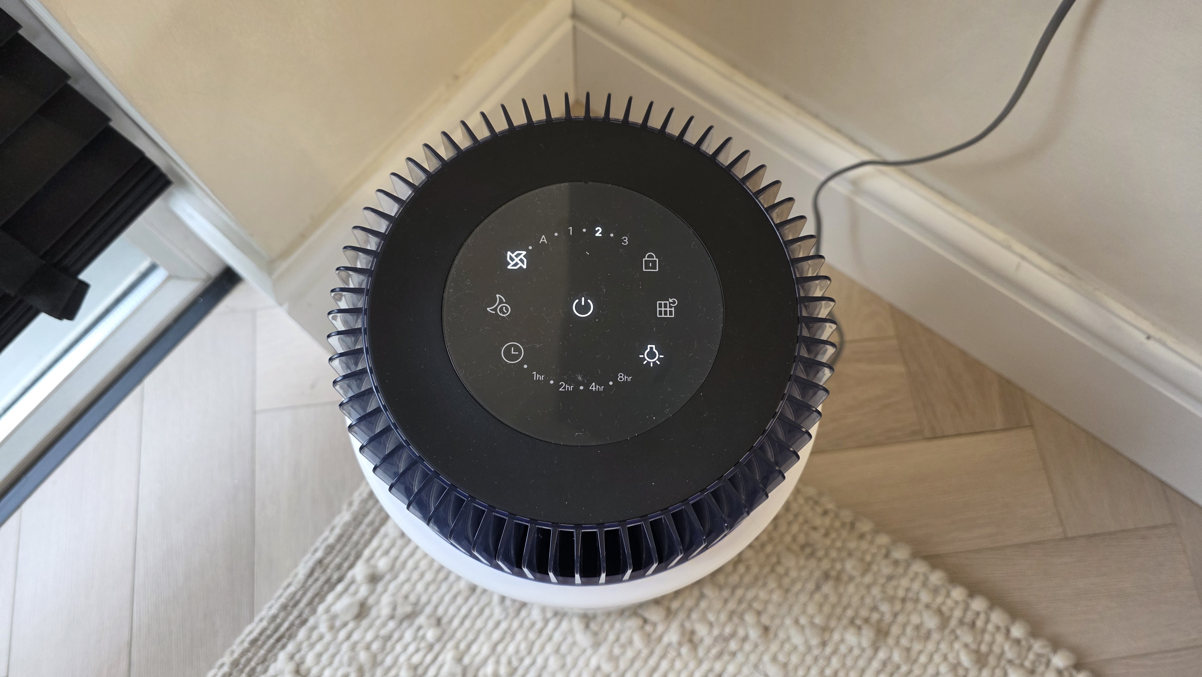 The Coway Airmega 100 from above, showing its buttons.